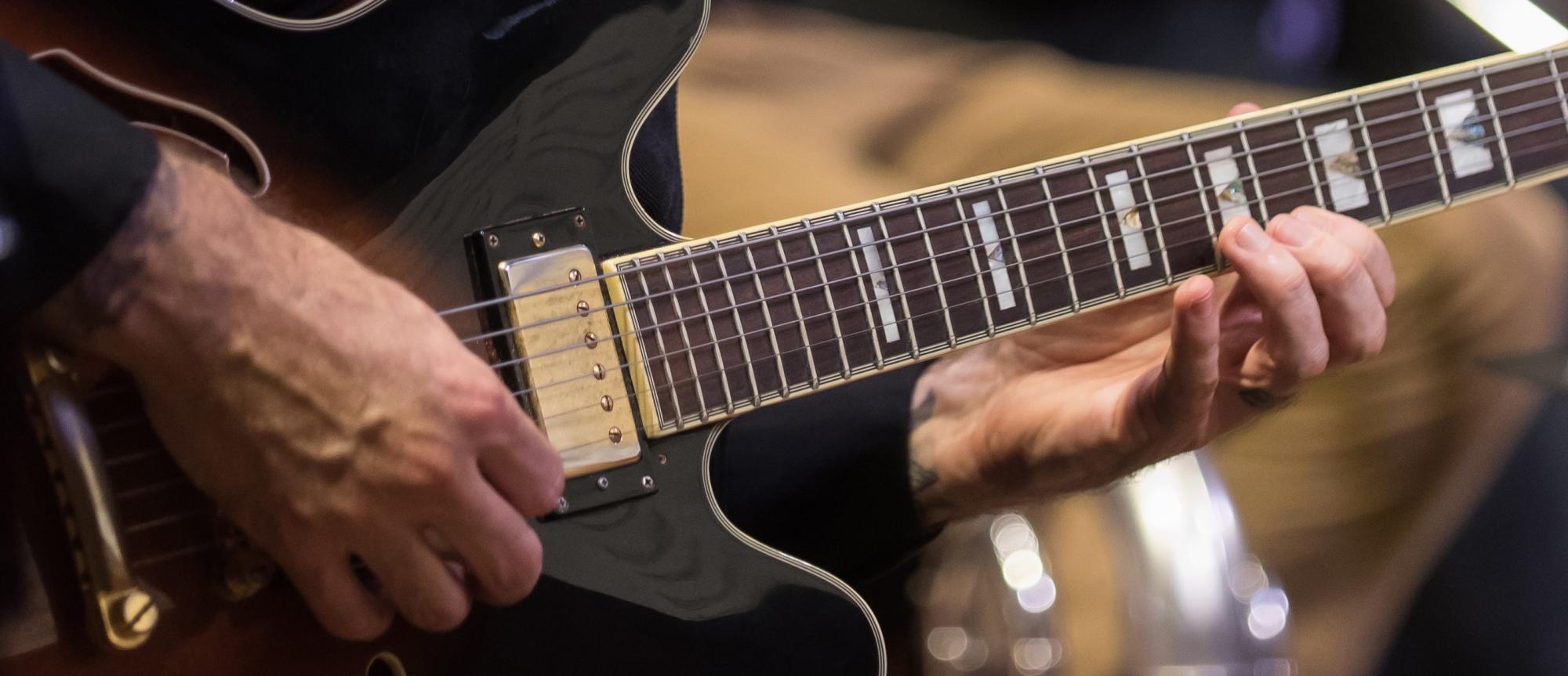 Closeup of guitar being played