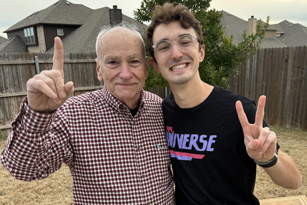 Jonah Hammett standing next to his grandfather 