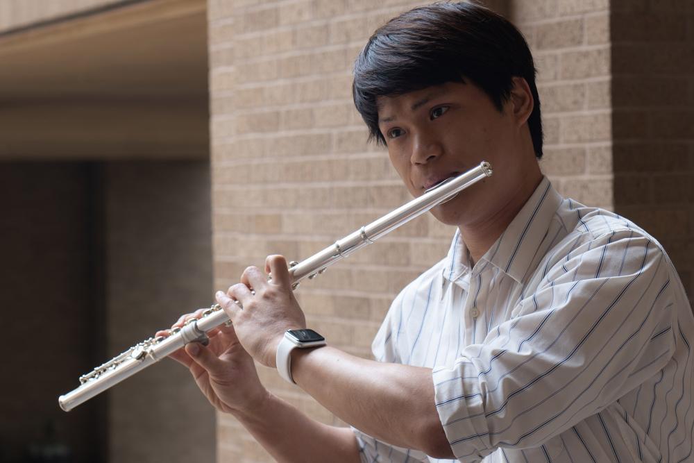 Michael Hung playing the flute