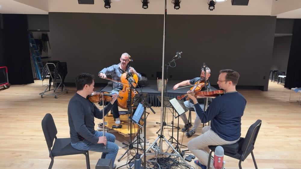 The Miro Quartet recording in a recording studio