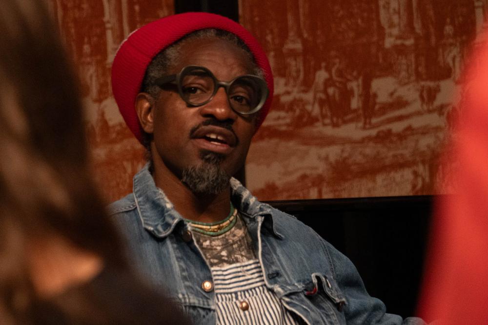 Andre3000 talking with a student