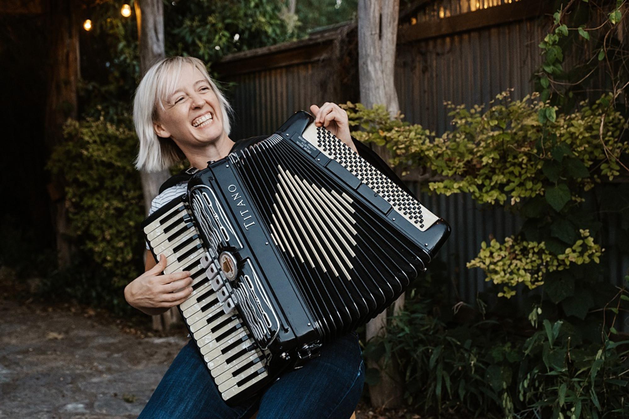 Closeup of Chelsea Burns playing her accordion