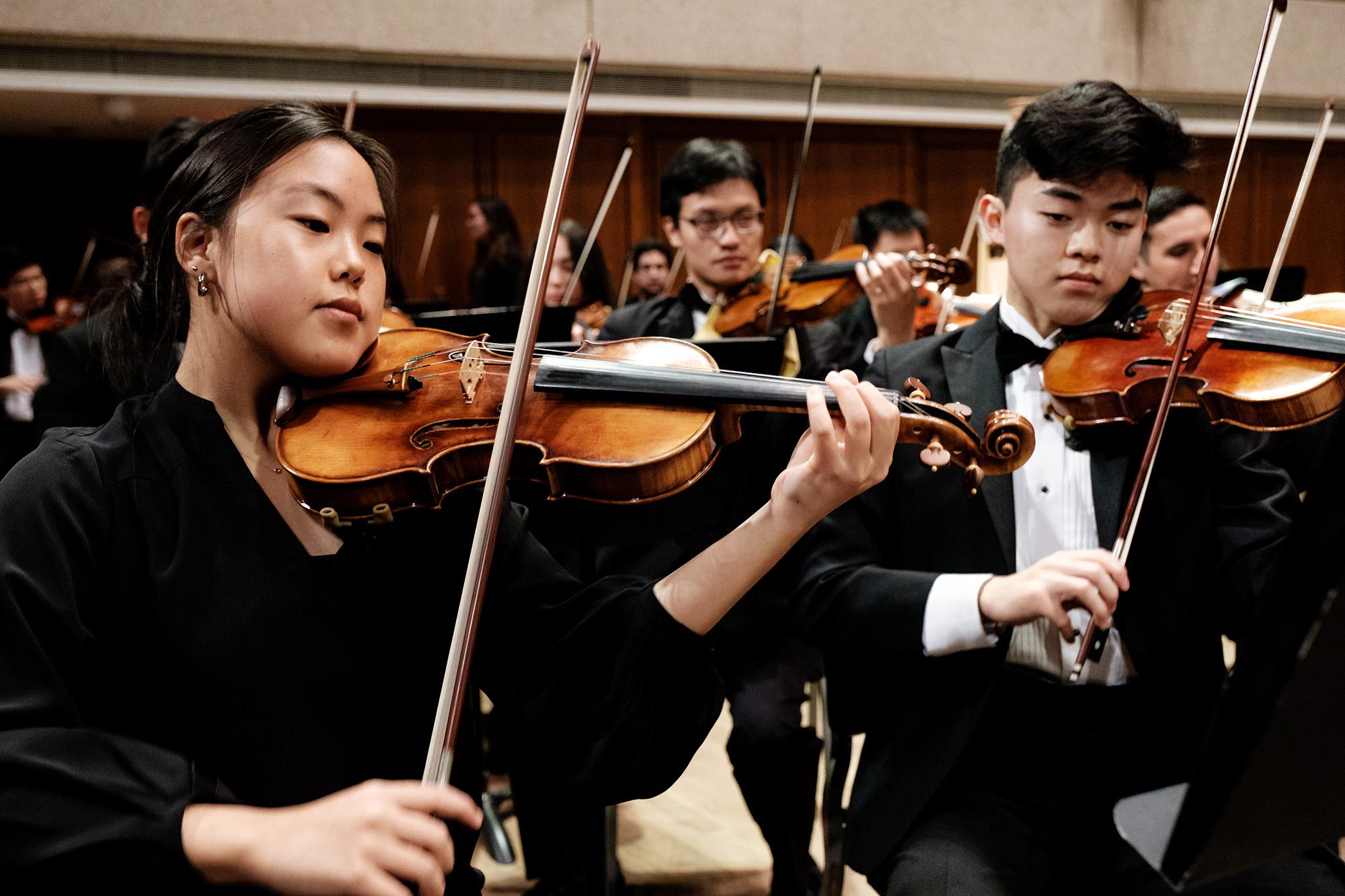 First and second violinists perform at a University Orchestra concert.