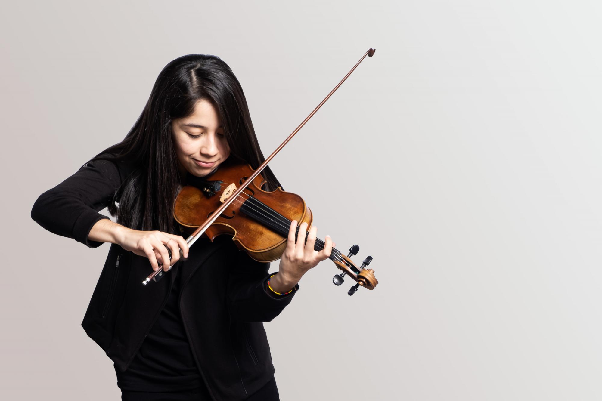 A Violinist playing her instrument