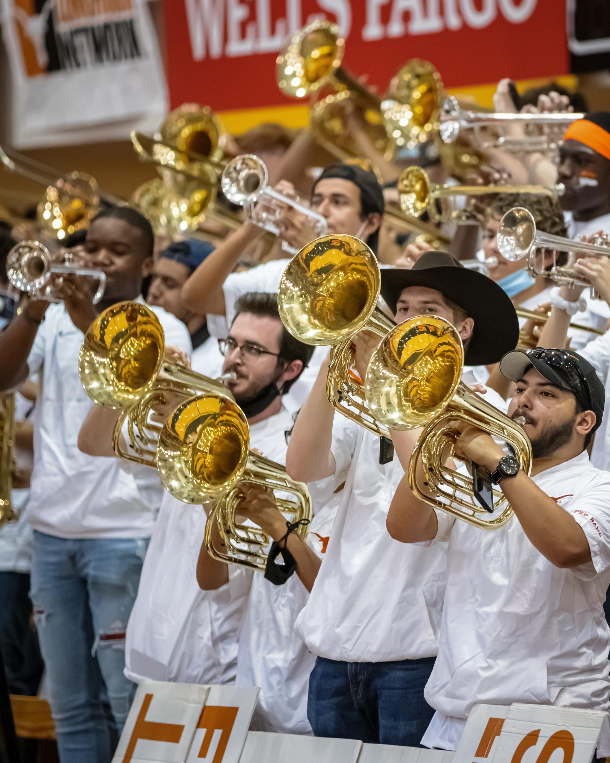 A Line of horns play at a UT Basketball game