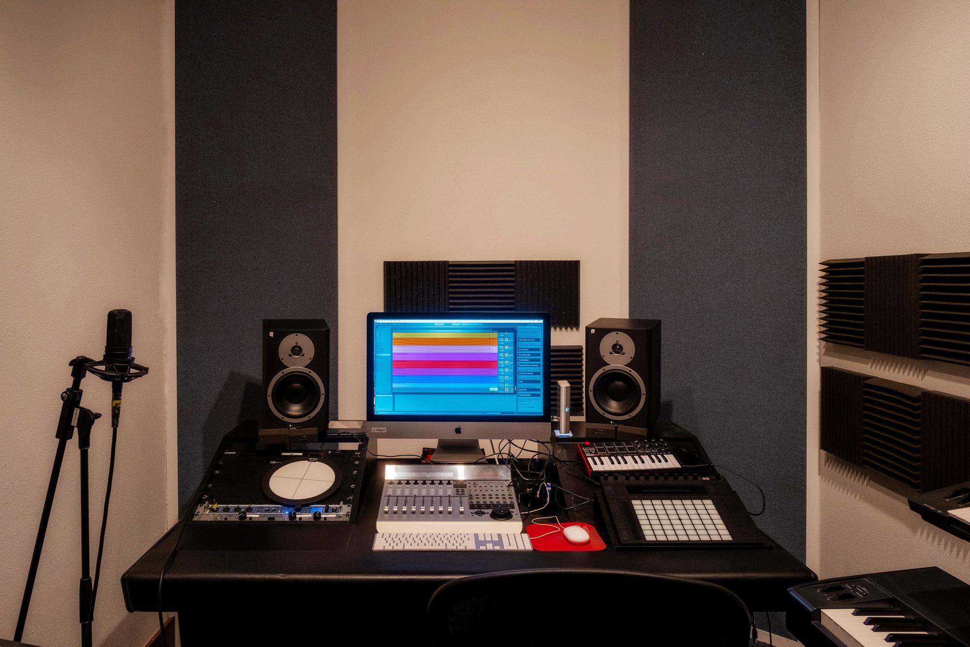 A desk with electronic music equipment