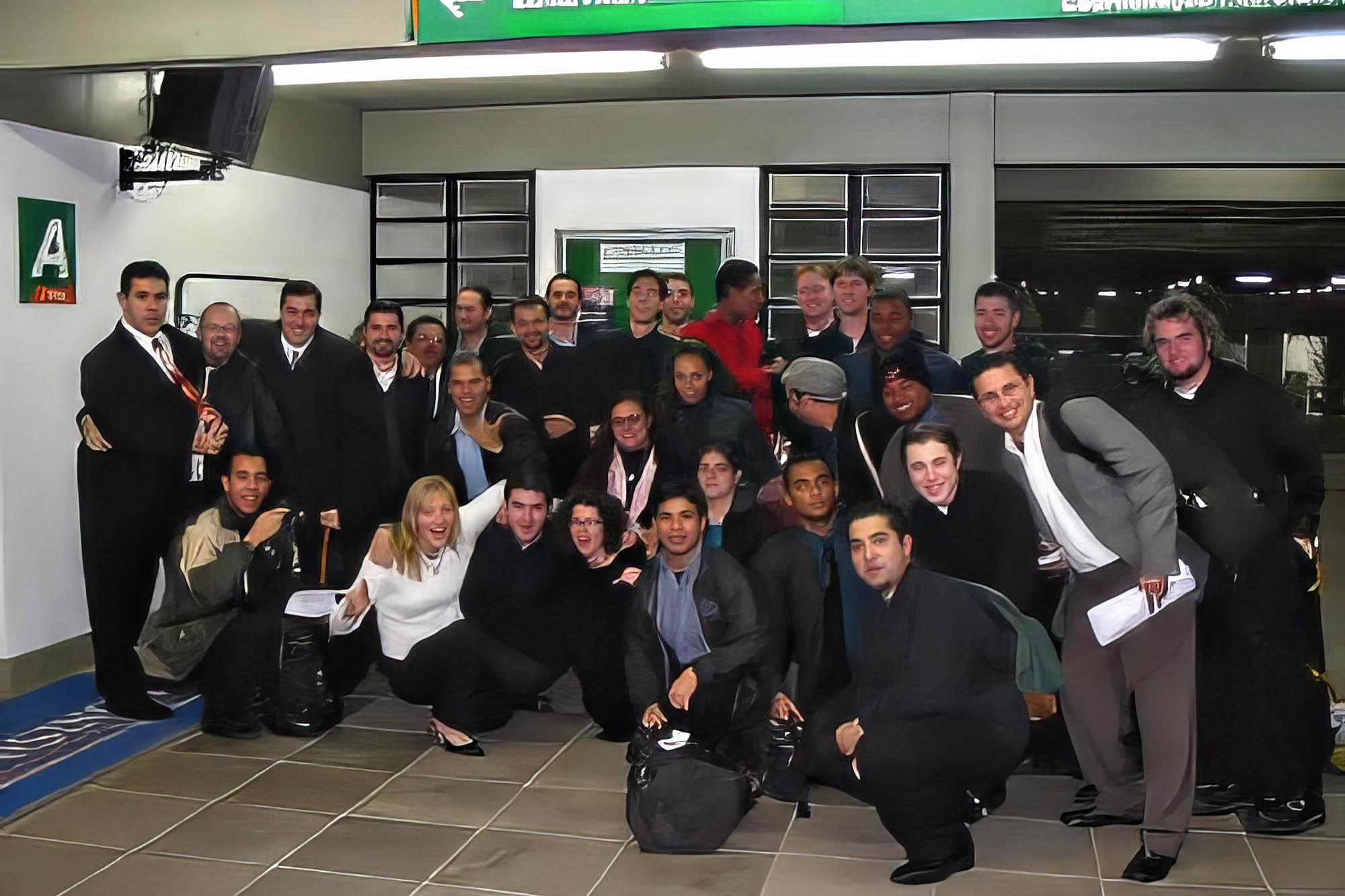 the trombone choir poses for a casual group photo at the airport