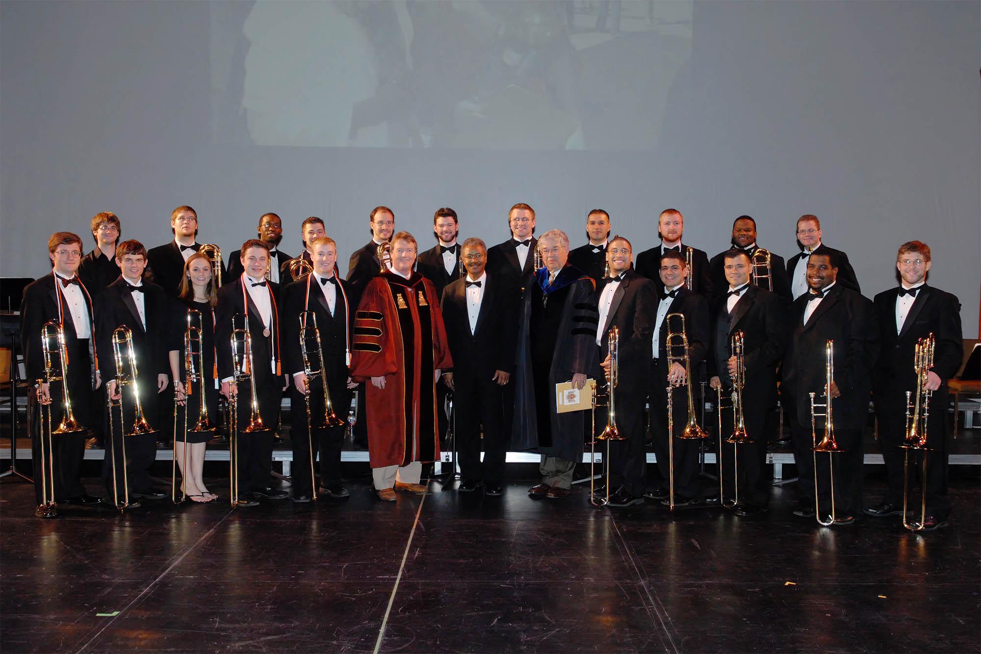 The 2006 trombone choir poses with the University President and the Dean of the College of Fine Arts