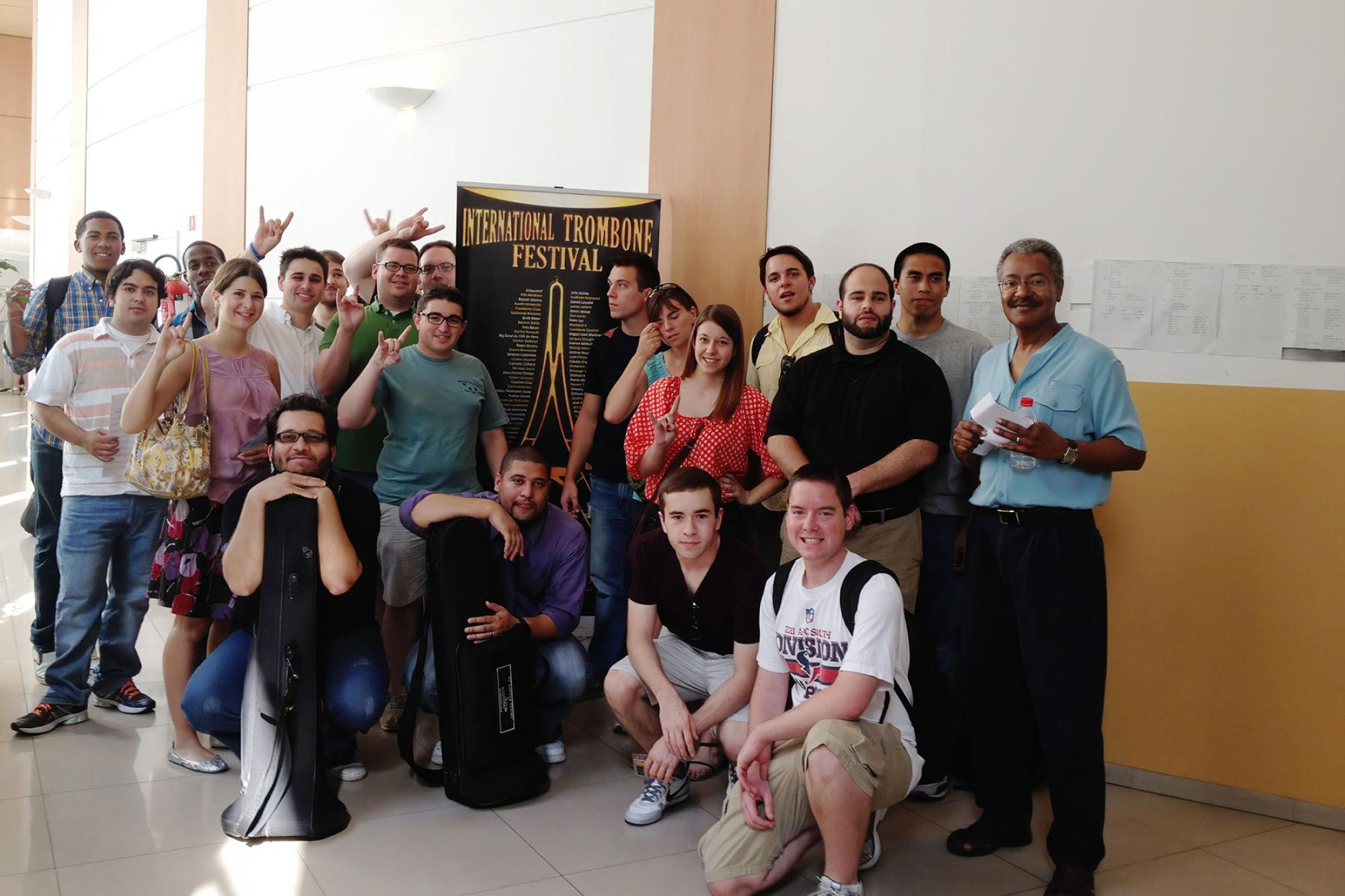 The choir poses for a casual group photo in the hallway of conference center