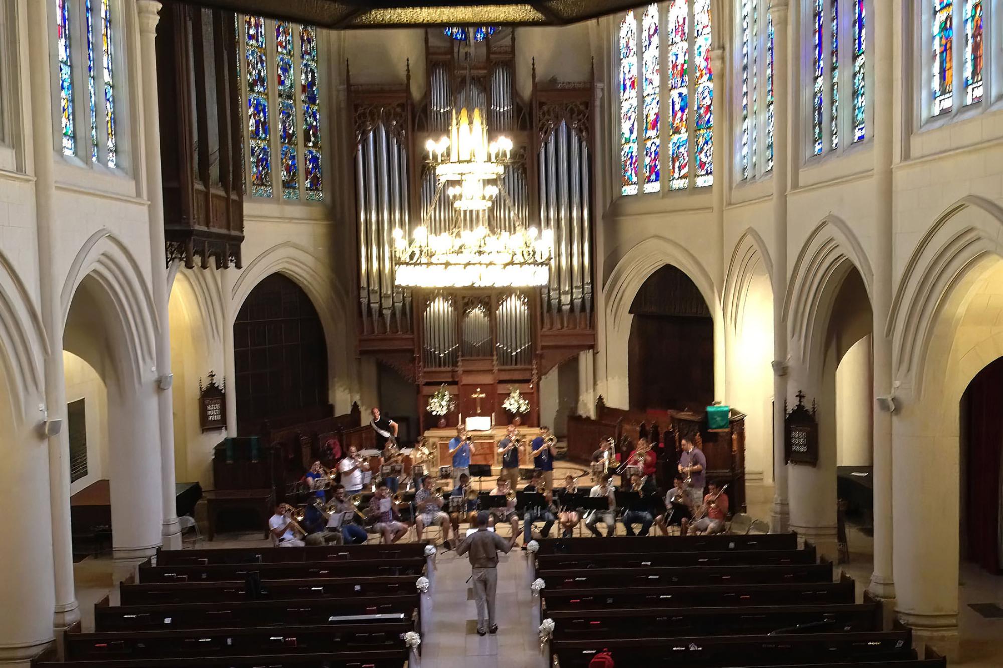 Trombone choir performs inside a cathedral 