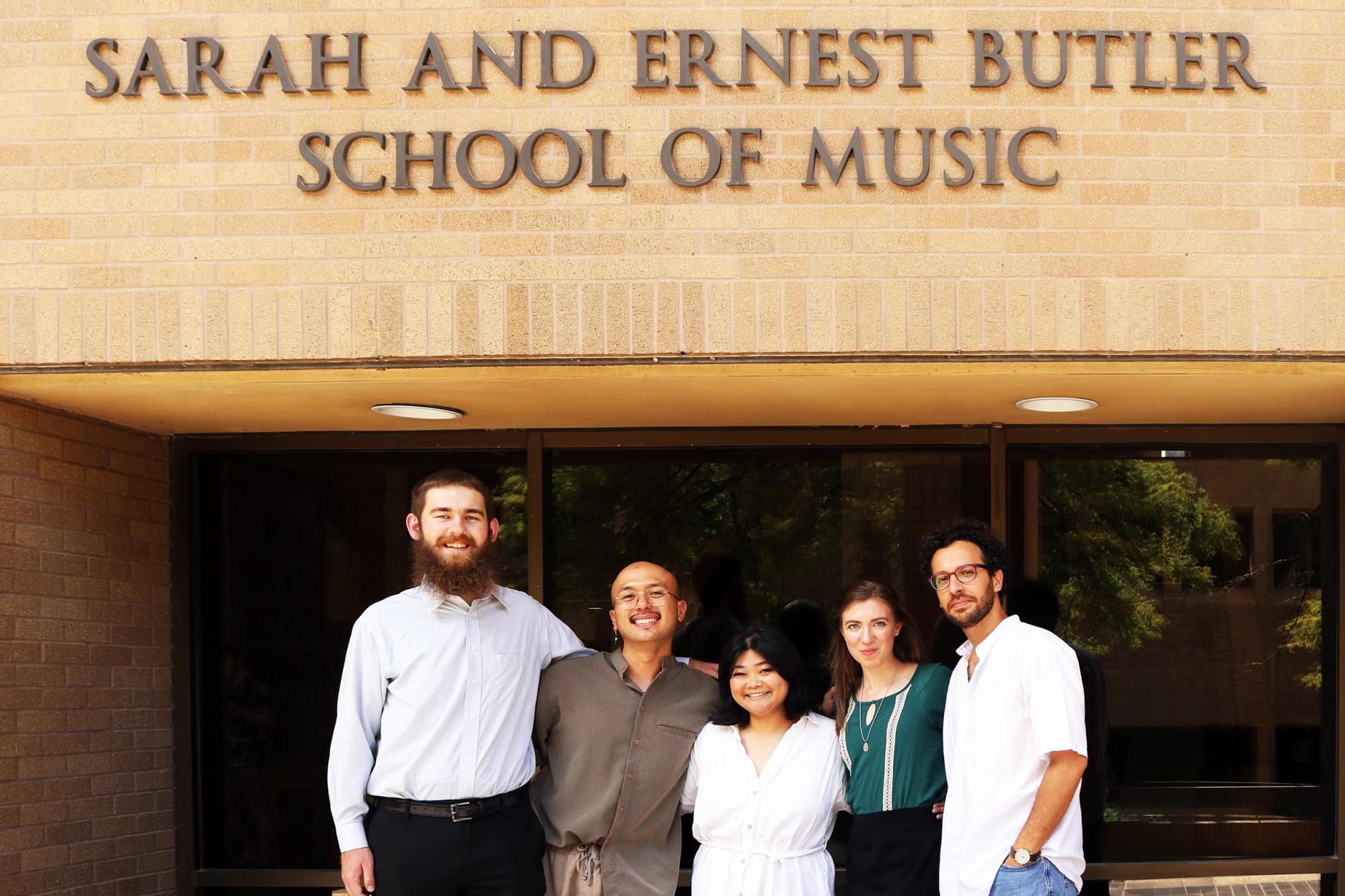 The 24-25 AGEMS student executive board stands outside the Butler School Building on the UT campus.