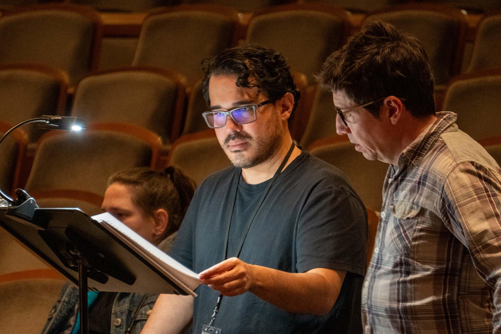 Sam Lipman and Pablo Zamora look at sheet music