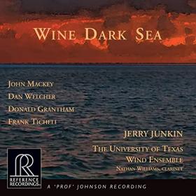 Album cover; a dark blue sea scape at sunset