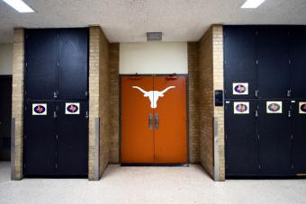 Hallway and Burnt Orange Door with Longhorn icon 