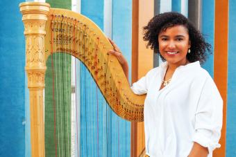 Mallory McHenry poses with harp