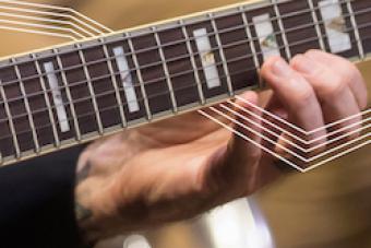 Closeup of guitar being played