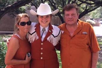 Longhorn Band student Francesca Revella pictured with her parents