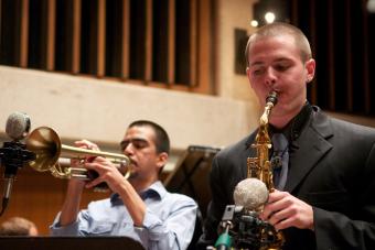 a saxophone player and a trumpet player solo together during a jazz concert in Bates Recital Hall