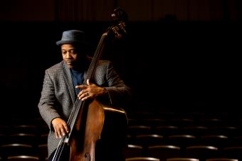 jazz bass player Rodney Whitaker plays his bass in an empty auditorium