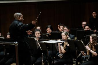 Clifford Croomes conducts a lyric passage during a Symphony Band performance