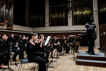 Clifford Croomes conducts the Symphony band on the Bates Hall Stage