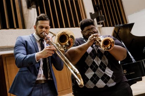 Trombonist and Trumpeter play a duet during a Jazz Orchestra Concerts in Bates