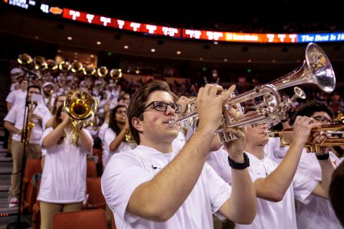 Members of Longhorn Pep Band perform at a basketball game