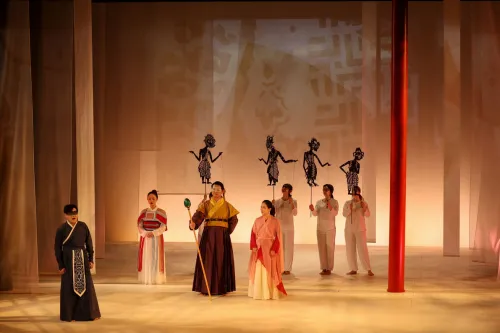 singers on stage in traditional Chinese dress