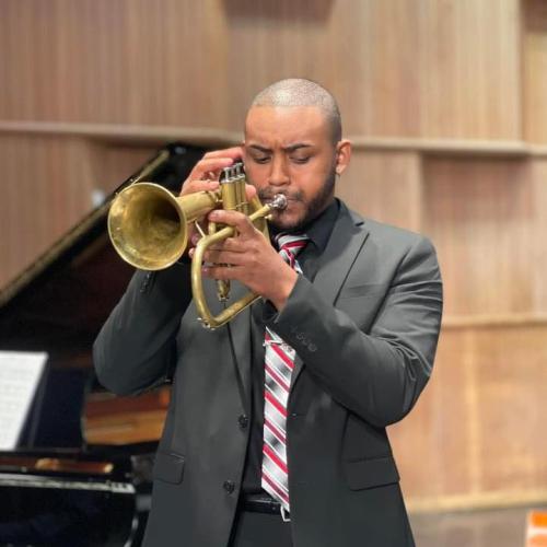 Jason Grant plays his trumpet on stage