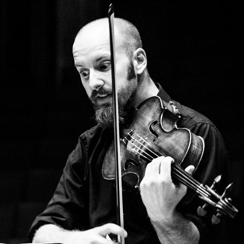 Russell Podgorsek plays his viola during a performance. 