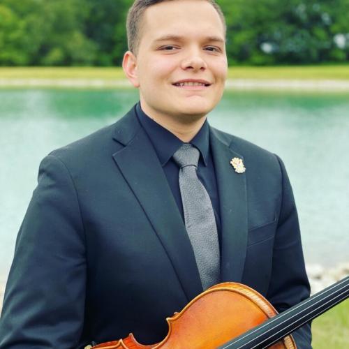 a headshot of Dean Roberts with his viola