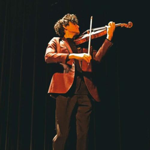 Kendall Weaver plays his viola on stage
