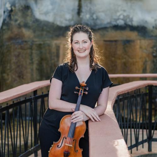 a headshot of Jennifer McKeeman with her violin