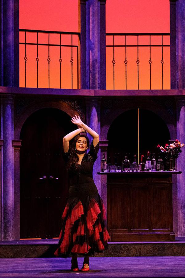 Carmen seductively dances on stage