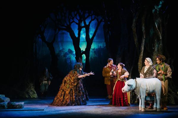 the witch beckons to the baker and his wife, while Jack and his mother look on. Their cow is nearby.