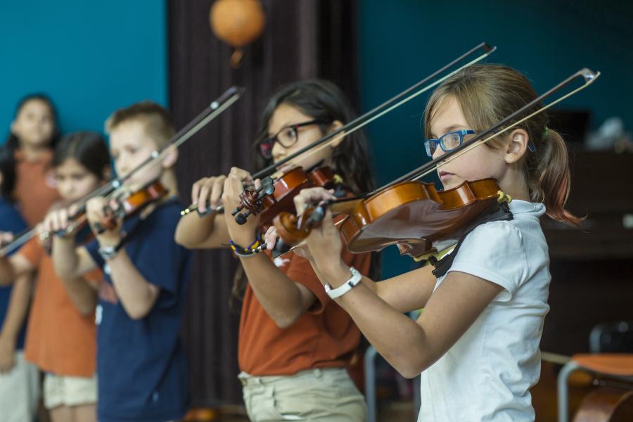 A photo of students in the string project