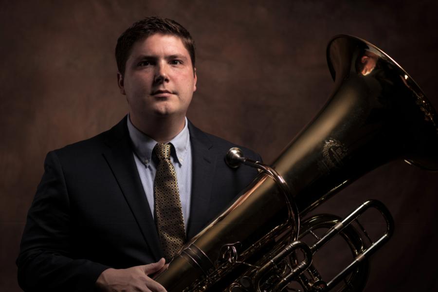 A headshot of Matt Hightower holding his tuba.