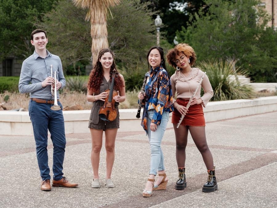 A group portrait of students holding their instruments