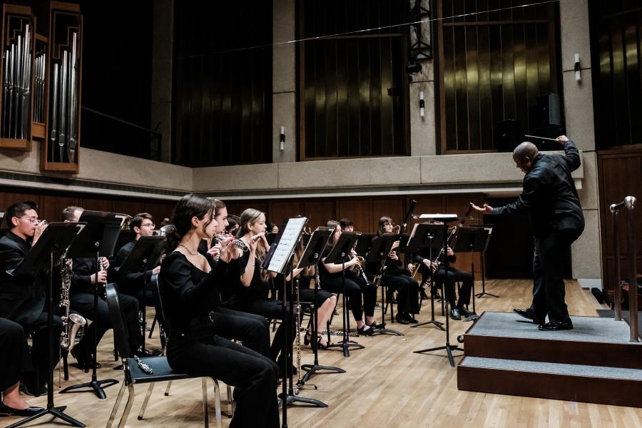 Clifford Croomes conducts the Symphony band on the Bates Hall Stage