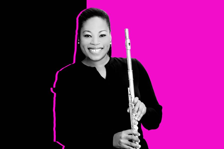 Black and white photo of Ebonee Thomas holding her flute in front of a black and aqua background.
