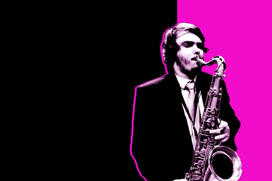 Black and white photo of a student playing a saxophone in front of a magenta and black background.