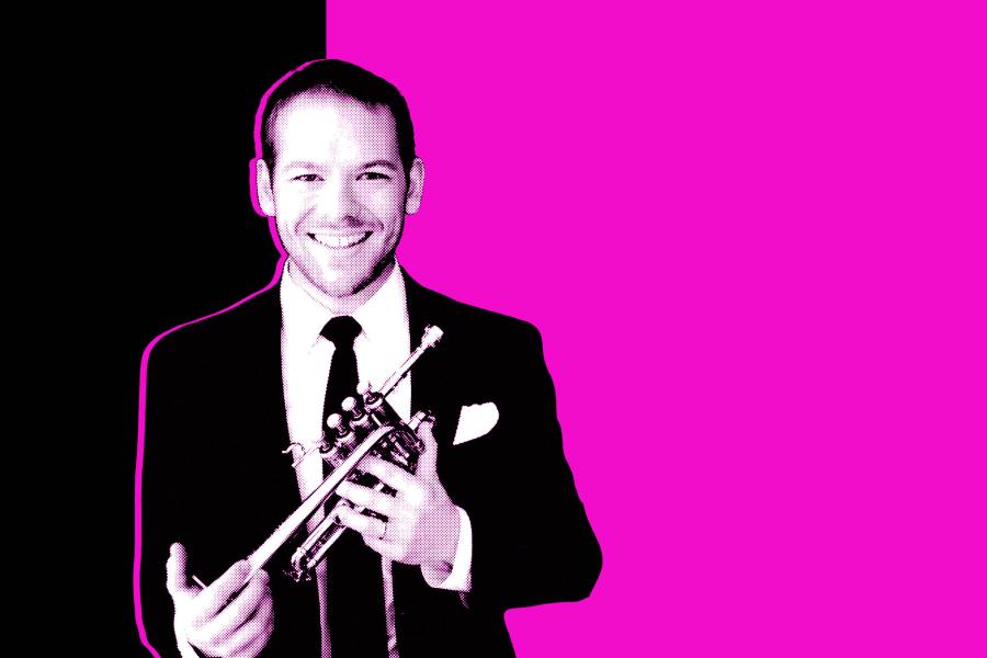 Black and white photo of Caleb Hudson holding his trumpet in front of a black and magenta background.