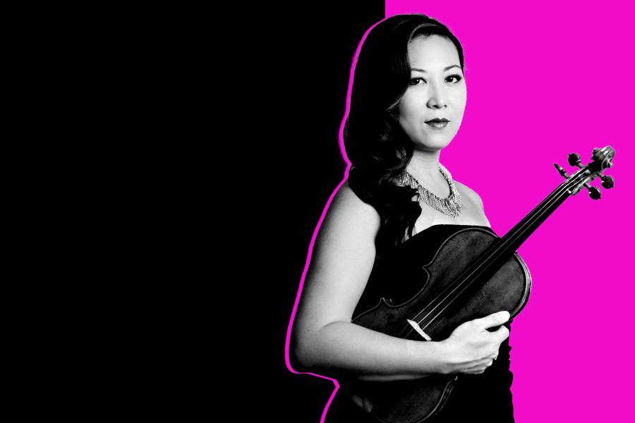 Black and white photo of Sandy Yamamoto holding her violin in front of a black and neon pink background.