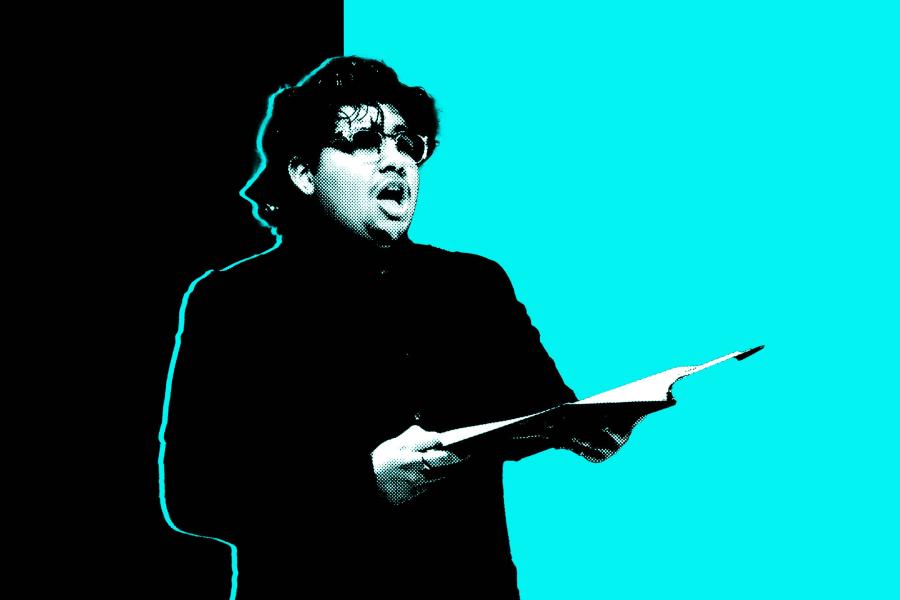 A black and white photo of a man singing while holding a score in front of an aqua and black background.