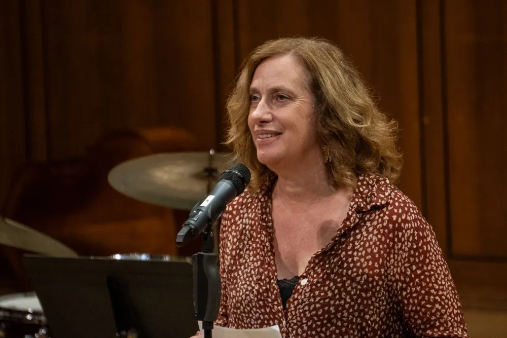 Susan Thomas talking into a mic