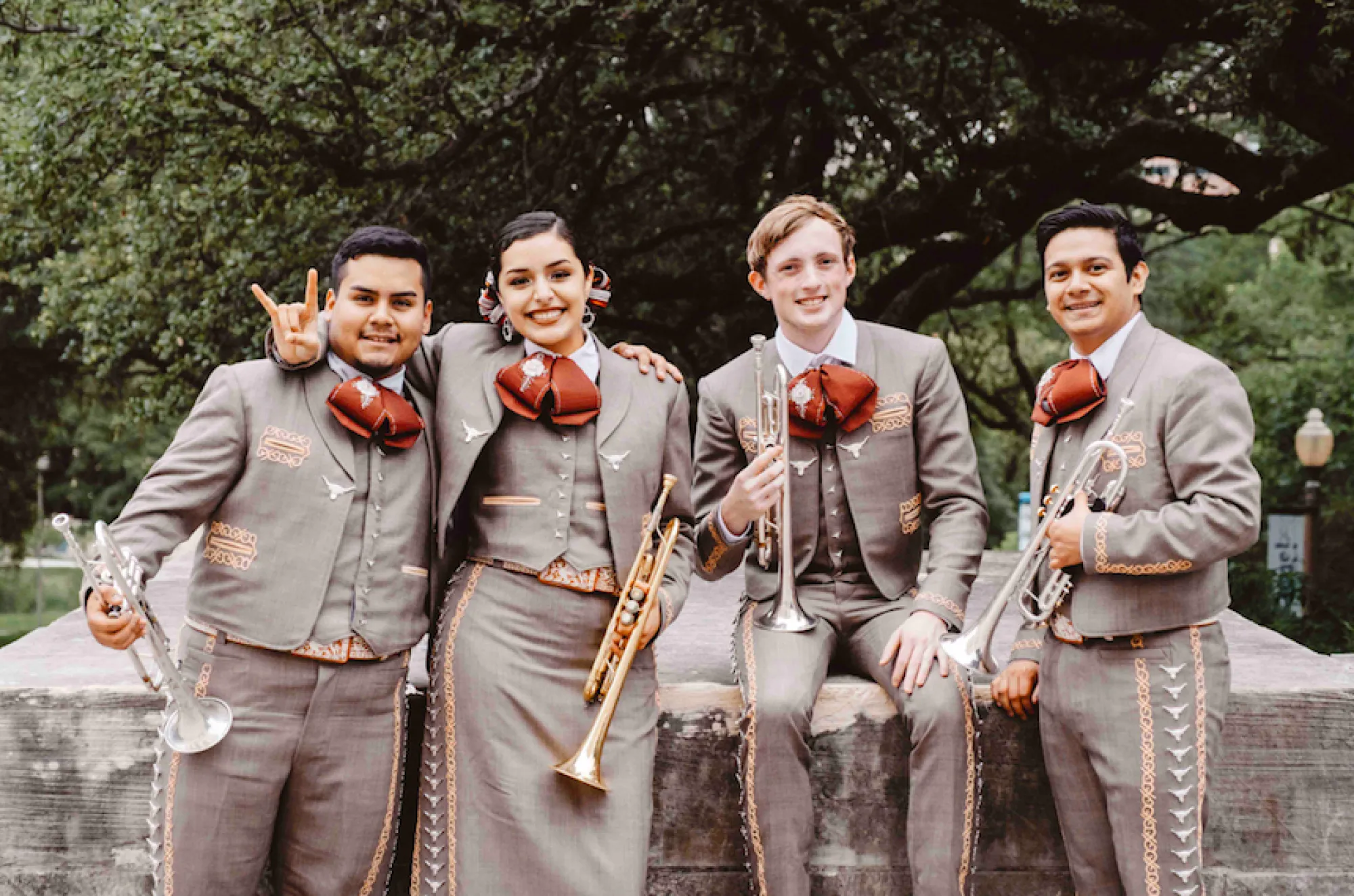 Students in the mariachi ensemble pose with their instruments