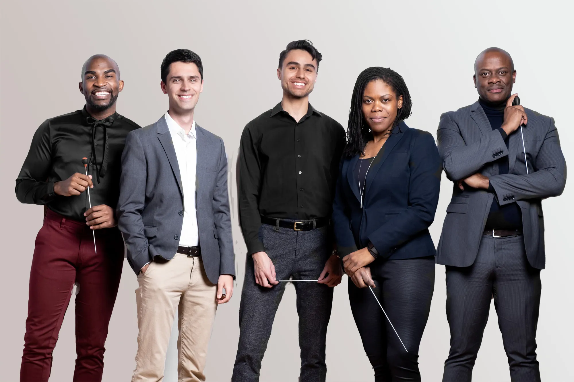 A group of conducting students pose with their batons