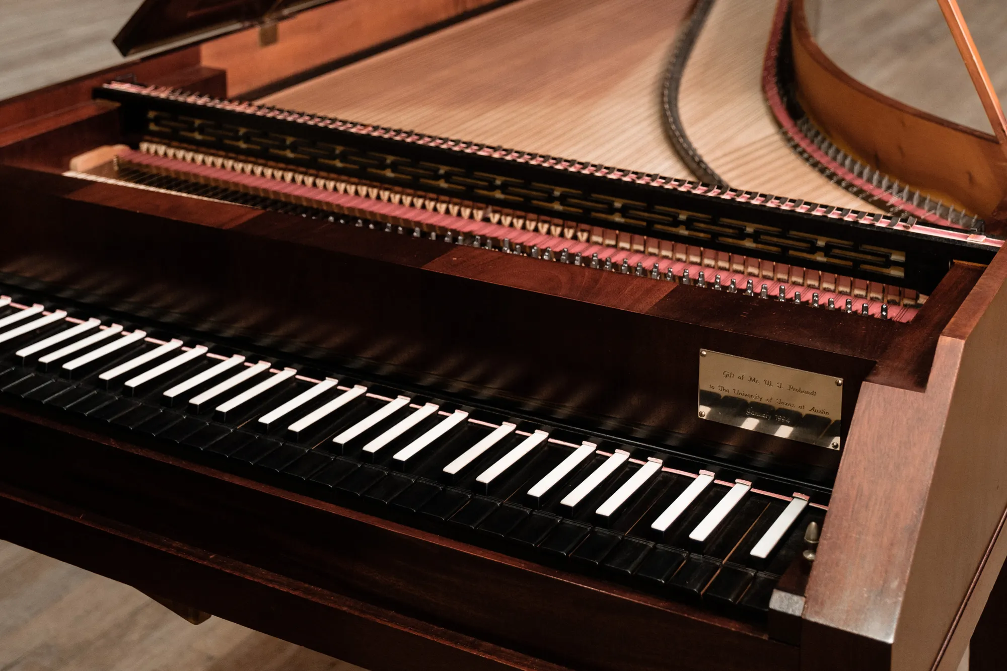A harpsichord sits on stage in Bates Recital Hall