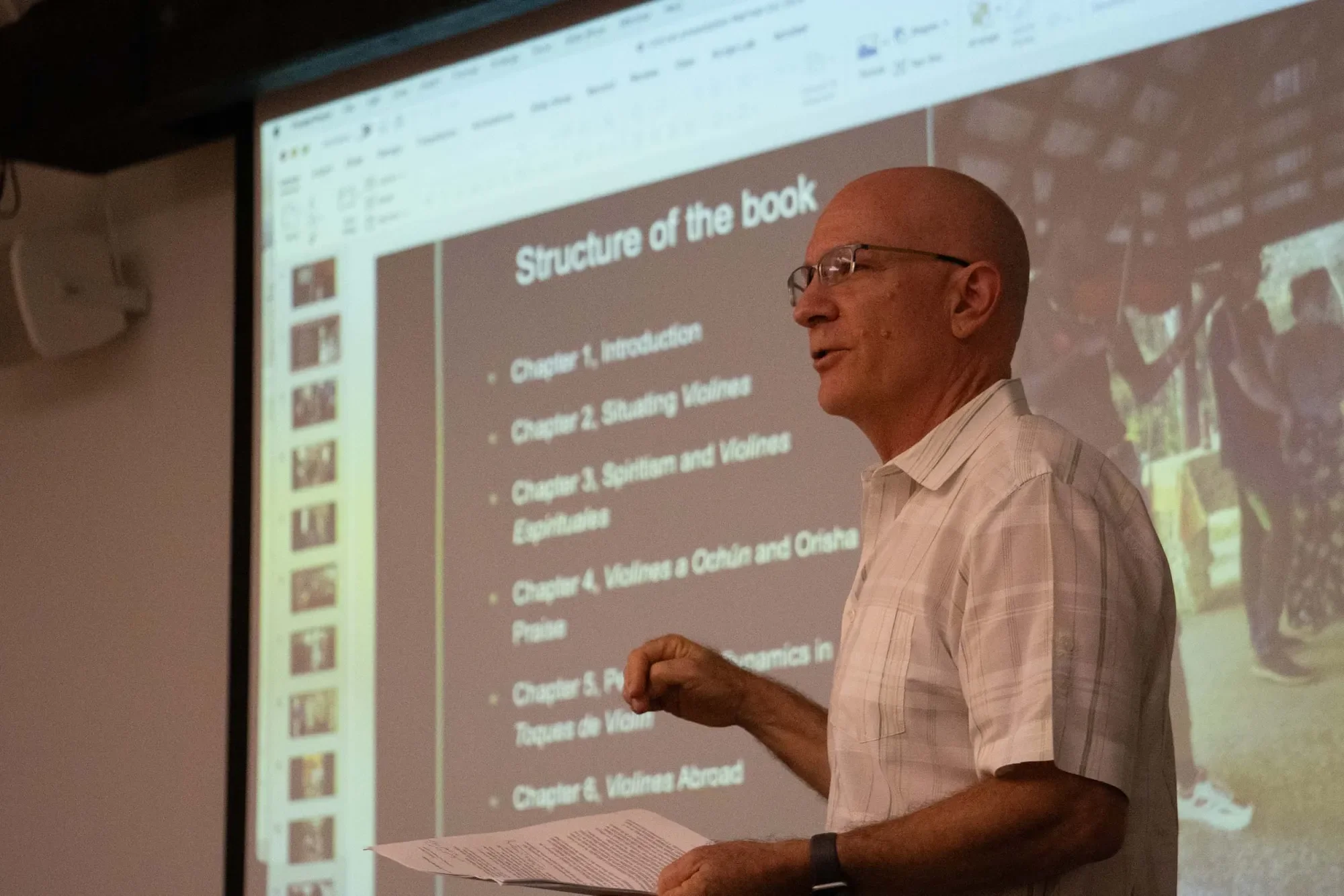Robin Moore talking with a computer projection in background