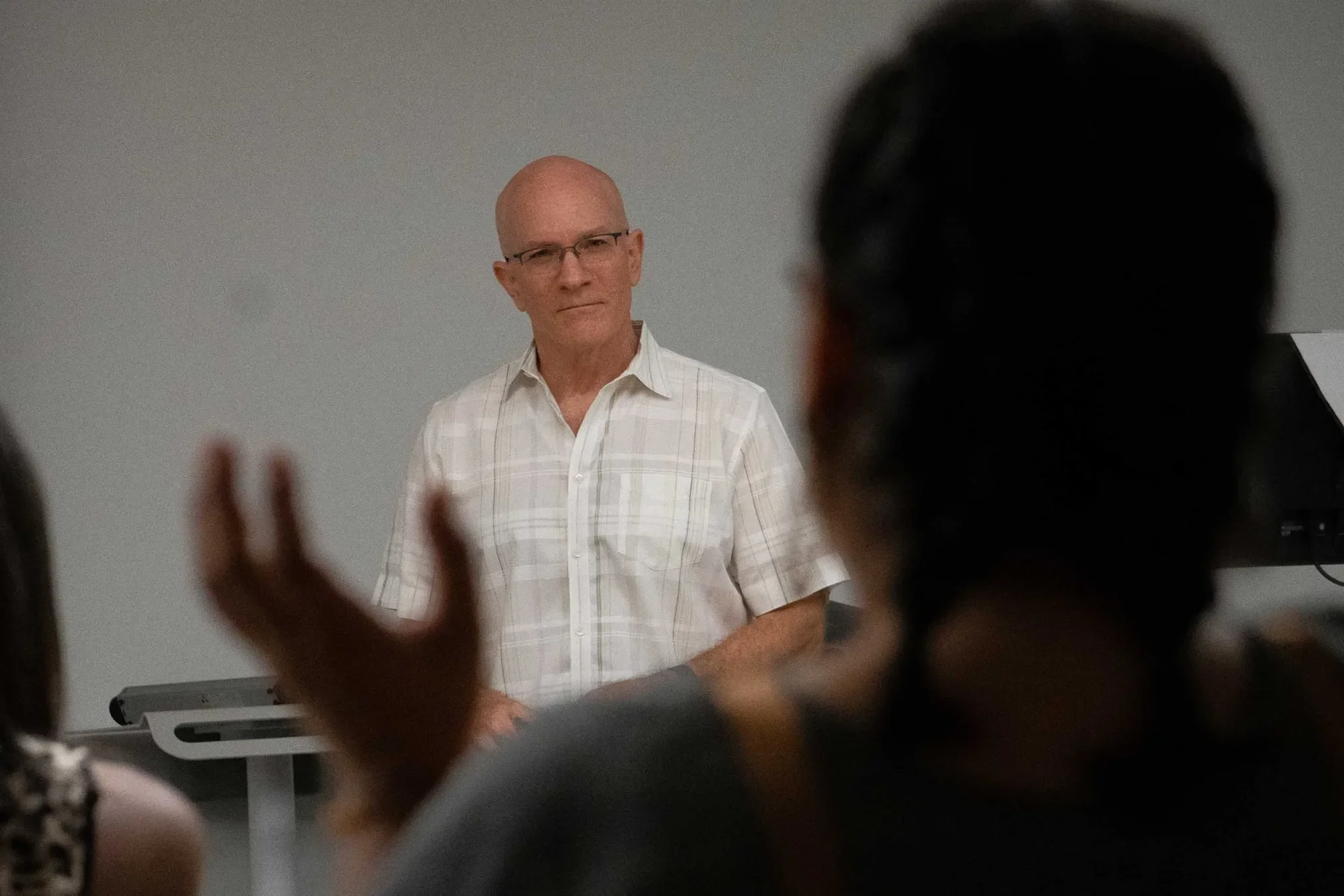 Robin Moore talking listens to a student asking a question